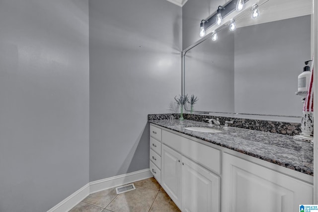 bathroom with tile flooring and vanity