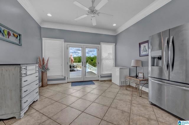 sitting room featuring ceiling fan, crown molding, and light tile floors