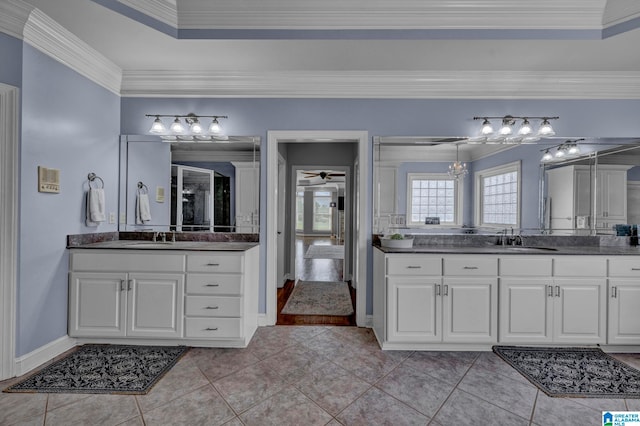 bathroom featuring ornamental molding, tile floors, a notable chandelier, and double sink vanity