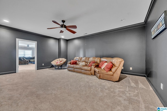 unfurnished living room with ceiling fan, crown molding, and carpet flooring