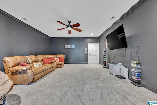 living room with ornamental molding, carpet, and ceiling fan