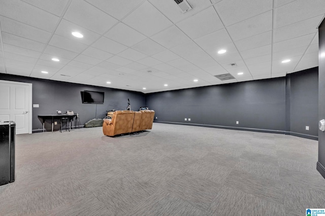 interior space featuring a drop ceiling and carpet