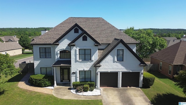 view of front facade featuring a garage and a front yard