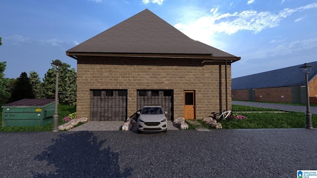 view of side of home with a garage