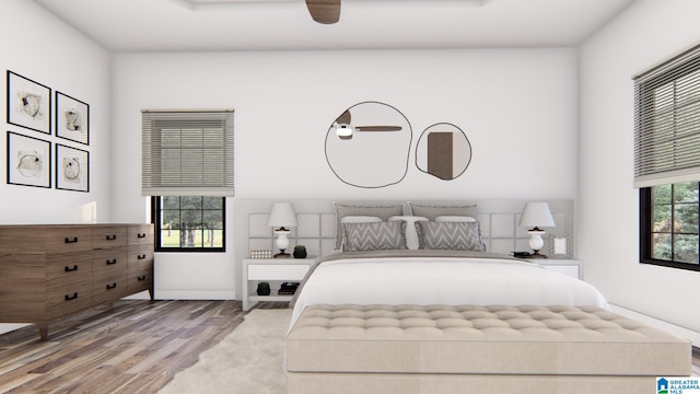 bedroom with ceiling fan and hardwood / wood-style floors