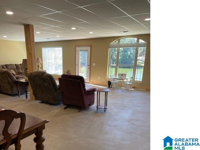 living room featuring a drop ceiling