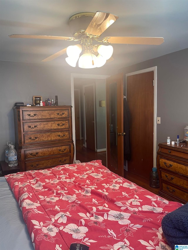 bedroom featuring dark hardwood / wood-style flooring and ceiling fan