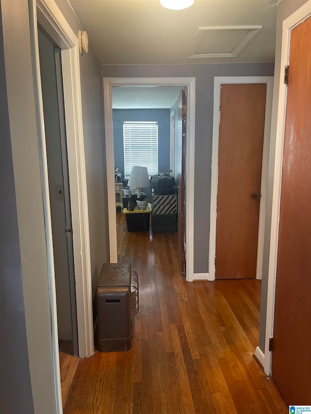 hallway with dark hardwood / wood-style floors