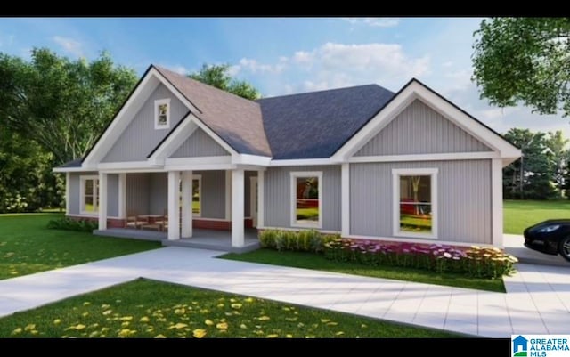 view of front of house featuring a front lawn and covered porch