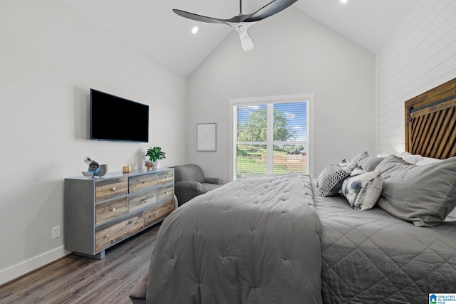 bedroom with high vaulted ceiling, ceiling fan, and dark wood-type flooring