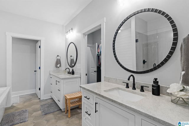 bathroom featuring tile flooring, a bathing tub, and double sink vanity