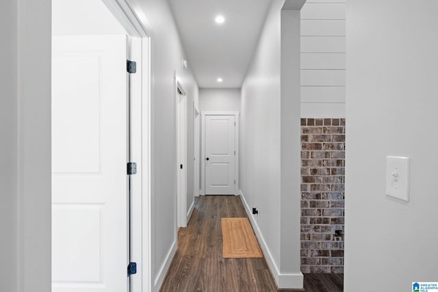 hallway with dark hardwood / wood-style floors