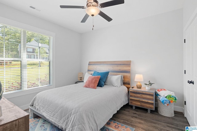 bedroom featuring dark wood-type flooring and ceiling fan