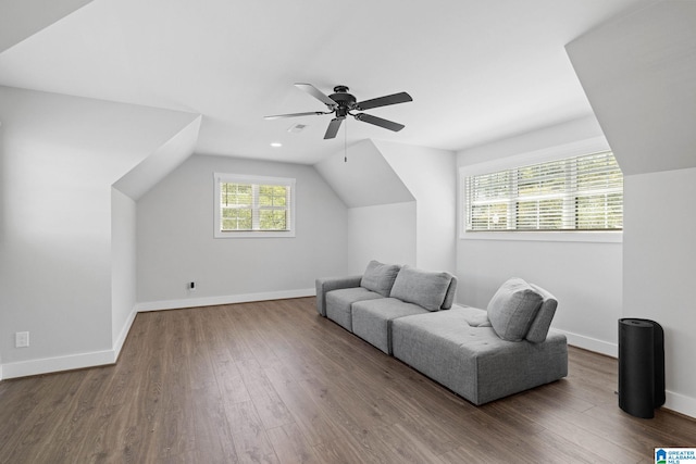 sitting room with dark hardwood / wood-style flooring, ceiling fan, and lofted ceiling