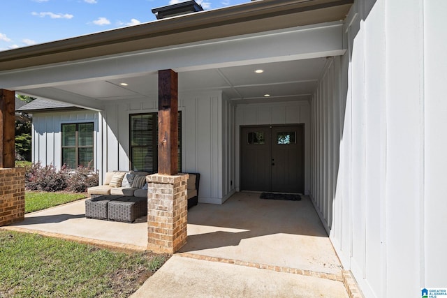 entrance to property with outdoor lounge area