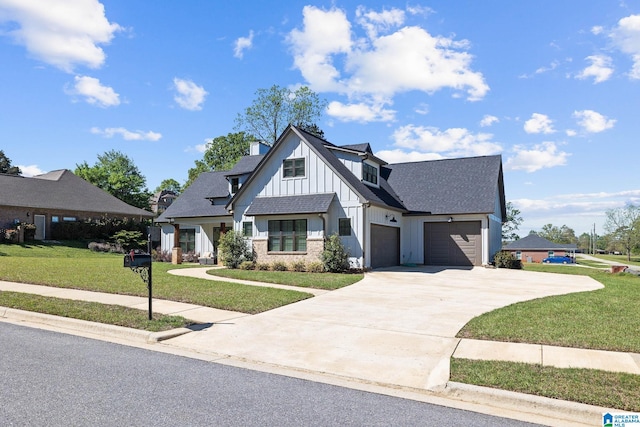 modern farmhouse style home featuring a garage and a front yard