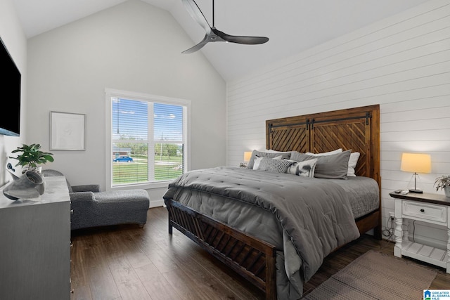 bedroom with ceiling fan, high vaulted ceiling, and dark hardwood / wood-style flooring