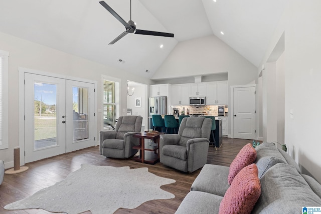 living room with hardwood / wood-style flooring, french doors, ceiling fan, and high vaulted ceiling