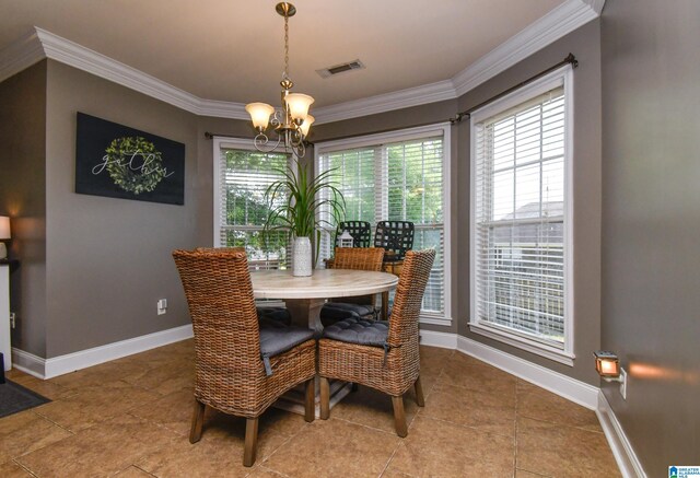 tiled dining area with a healthy amount of sunlight, crown molding, and an inviting chandelier