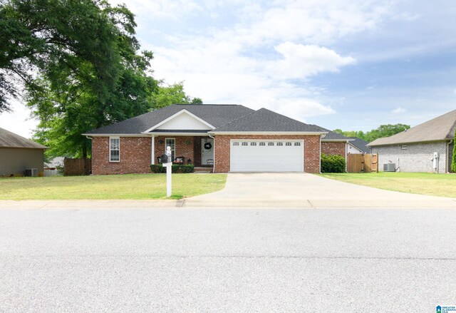 single story home featuring a front lawn and a garage