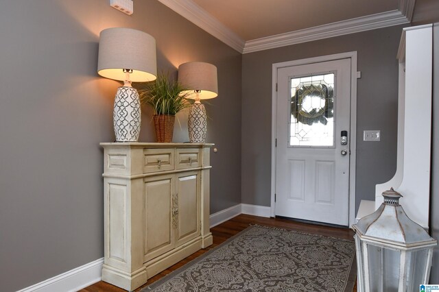 entrance foyer with dark wood-type flooring and ornamental molding