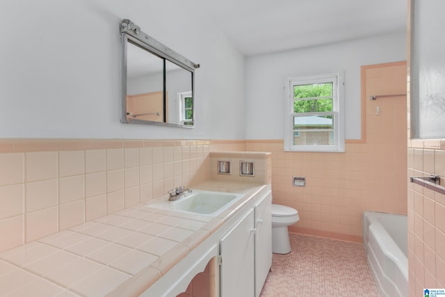 full bathroom with tile floors, tile walls, vanity, backsplash, and toilet