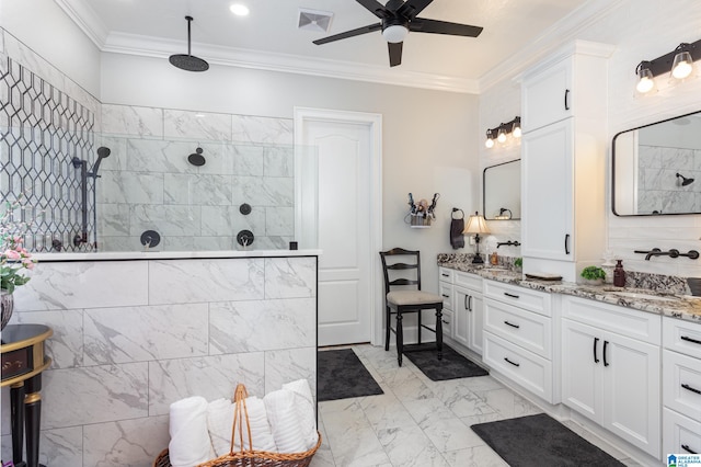 bathroom with vanity, ceiling fan, ornamental molding, and a tile shower