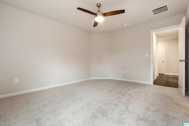 carpeted empty room featuring ceiling fan