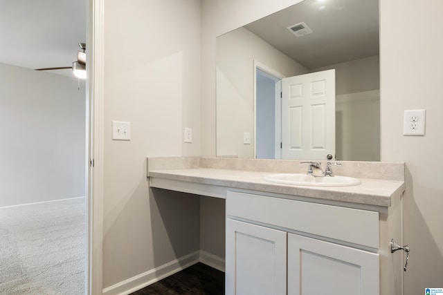 bathroom with ceiling fan and vanity