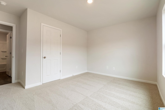 unfurnished bedroom with a closet and carpet