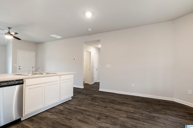 kitchen with sink, stainless steel dishwasher, ceiling fan, dark hardwood / wood-style flooring, and white cabinetry