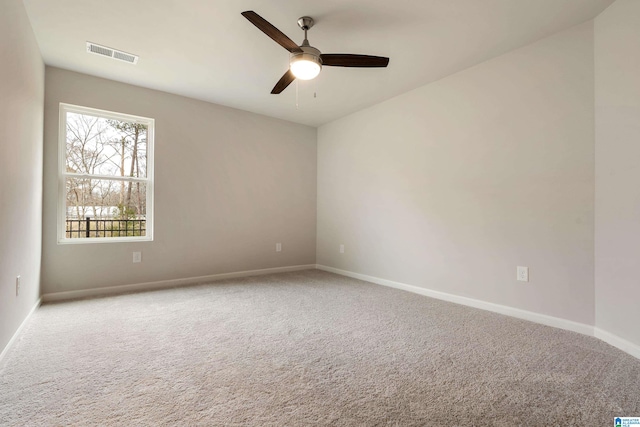 spare room with light carpet and ceiling fan