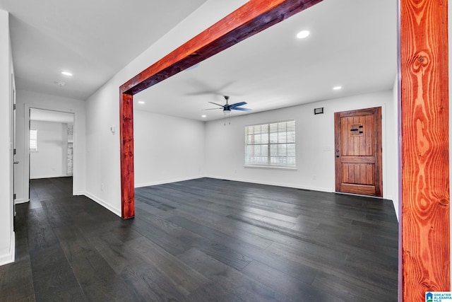 interior space with ceiling fan and dark hardwood / wood-style floors