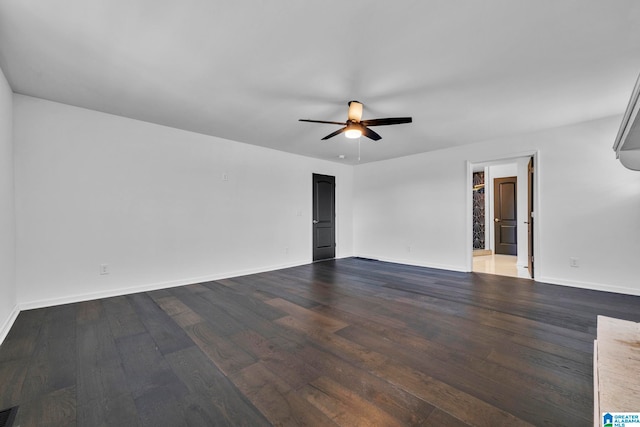 empty room with ceiling fan and hardwood / wood-style flooring