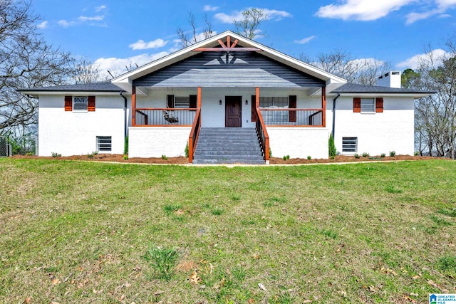 view of front of home featuring a front yard and a porch