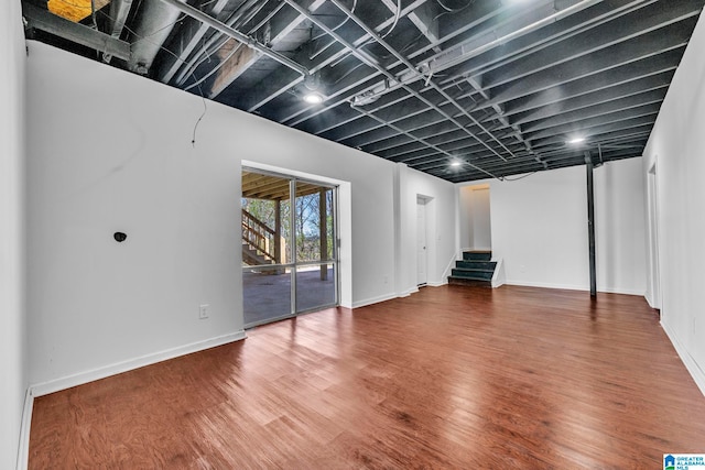 basement with hardwood / wood-style floors