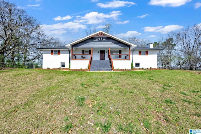 view of front of home with a porch and a front lawn