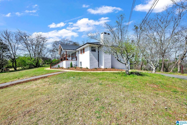 view of property exterior with a lawn