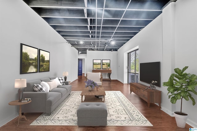 living room featuring a high ceiling and hardwood / wood-style floors