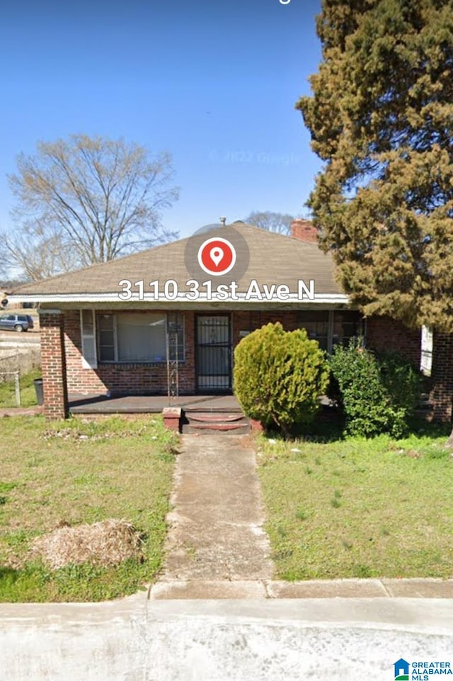 3110 N 31st Ave N, Birmingham, AL 35207 - view of front of home featuring brick siding and a front lawn