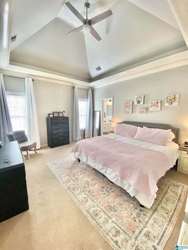 carpeted bedroom featuring ceiling fan, a raised ceiling, crown molding, and high vaulted ceiling