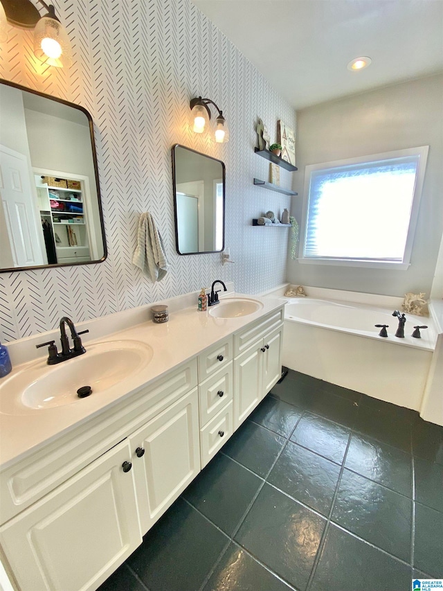 bathroom with vanity, a tub to relax in, and tile patterned floors