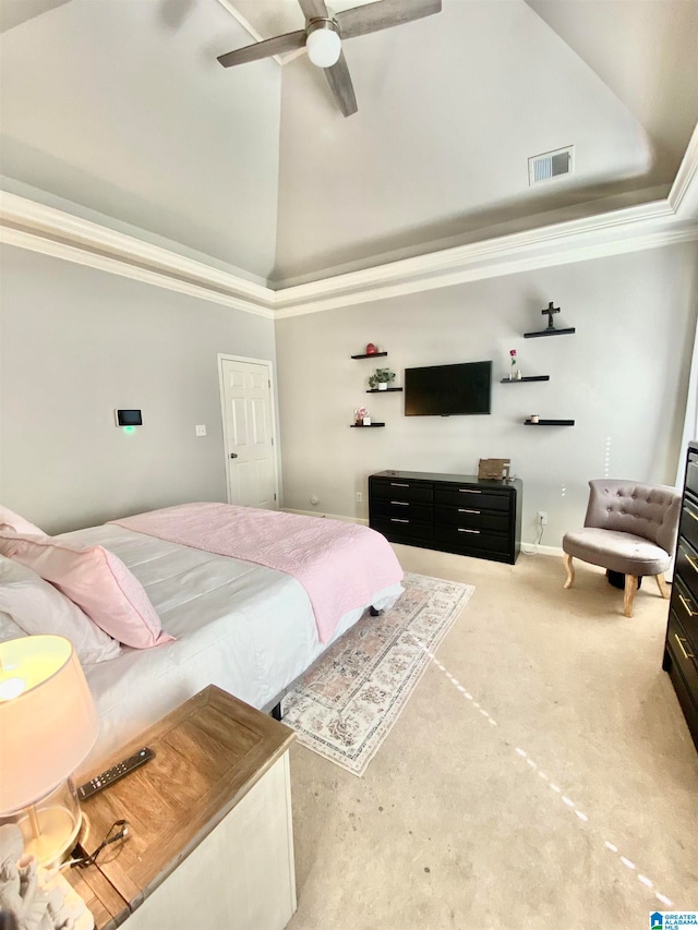 carpeted bedroom featuring ceiling fan, crown molding, and a high ceiling