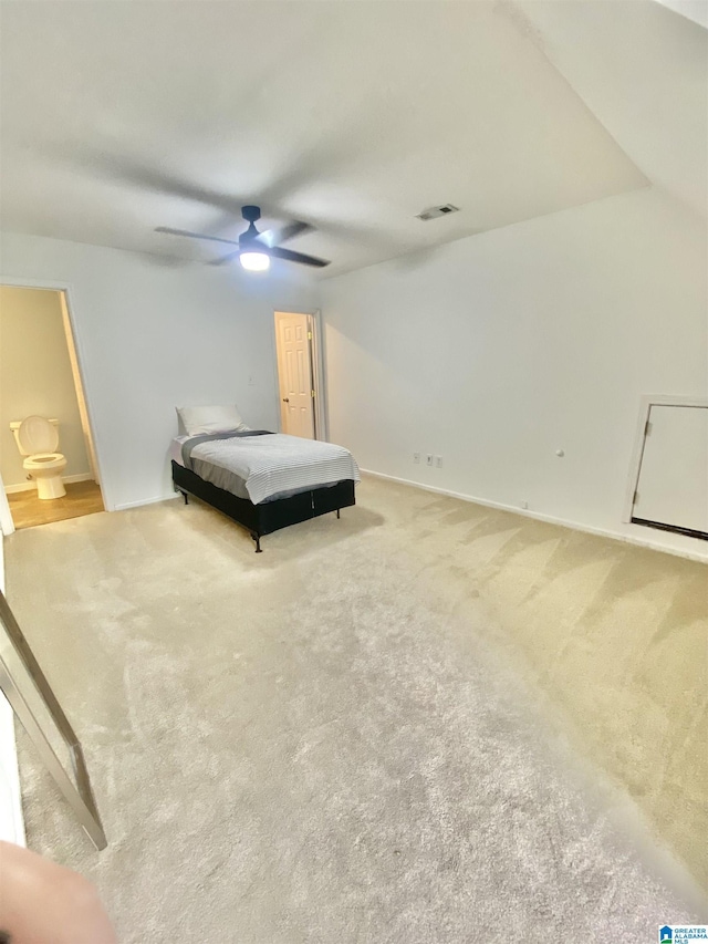 bedroom featuring ceiling fan, carpet floors, and connected bathroom