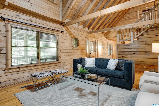 living room with plenty of natural light, wooden ceiling, beamed ceiling, and hardwood / wood-style floors