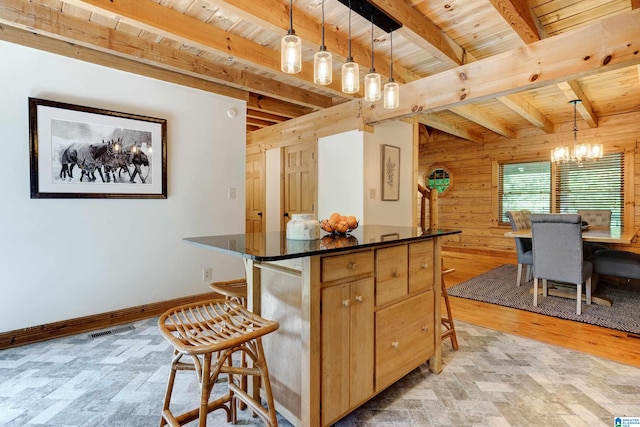 kitchen with wood ceiling, decorative light fixtures, and beamed ceiling