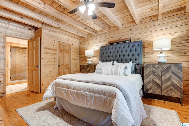 bedroom featuring beamed ceiling, wooden ceiling, ceiling fan, and wood walls