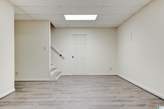 interior space with hardwood / wood-style flooring and a paneled ceiling