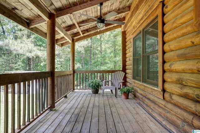 wooden terrace featuring ceiling fan