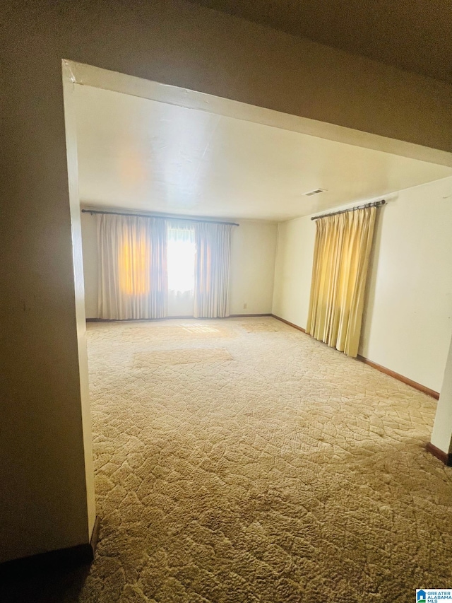 unfurnished room featuring carpet floors